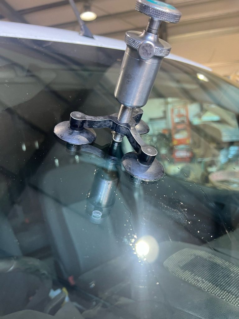 a windscreen chip being repaired - windscreen repairs in ashford kent